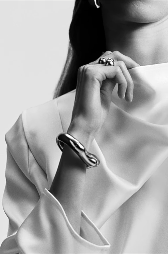 Fashion model wearing white top